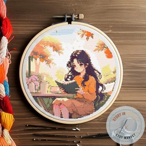 Anime Girl Reading Cross Stitch Pattern PDF Instant Download – A Woman Reading a Book under Autumn Leaves, for a Book Lover&#39;s Gift.