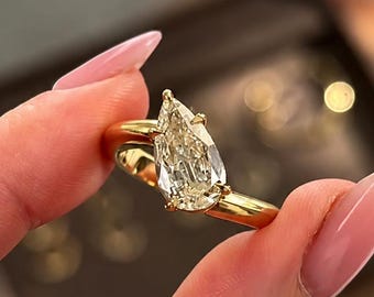 Pear Cut Modern White Moissanite Tilted Solitaire Ring, 14k Yellow gold setting