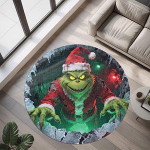 May include: Round rug featuring a green Grinch character wearing a Santa suit and hat. The Grinch has yellow eyes and a sinister grin. The rug has a green and red color scheme, with a snowy border.