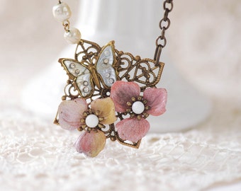 victorian style long pendant necklace with vintage butterfly and metal flowers, assemblage necklace, flower necklace