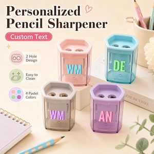 May include: Four hexagonal pencil sharpeners in pastel pink, blue, grey, and purple. Each features a two-hole design, a transparent body, and custom text on the front. The text reads Personalized Pencil Sharpener, Custom Text, 2 Hole Design, Easy to Clean, and 4 Pastel Colors.