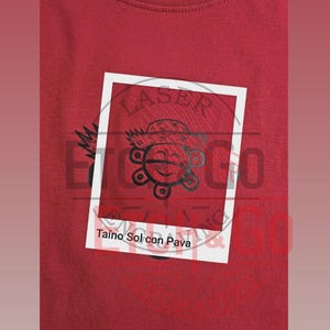 May include: A red crew neck sweatshirt with a white rectangular graphic. The graphic features a black cartoon sun design with the text "Taino Sol con Pava". The sweatshirt is made of a soft material.