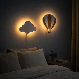 May include: A white ceramic mug with a black handle and the text "But First, Coffee" in a bold, black font. The mug sits on a white surface, showcasing its clean design.