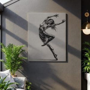 May include: A grayscale canvas print of a dancer in a dynamic pose. The artwork depicts a slender figure with outstretched arms and legs, capturing a moment of graceful movement. The dancer's form is detailed with shading, emphasizing the muscles and contours.