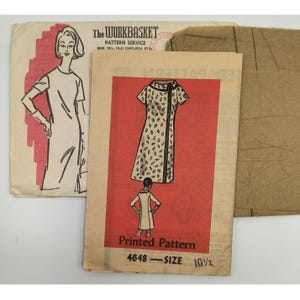 May include: Vintage sewing patterns from The Workbasket Pattern Service. The patterns feature illustrations of dresses, including a dress with a black trim and a dotted pattern. The size is 10 1/2.