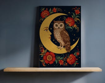 May include: A decorative canvas print featuring a brown owl perched on a golden crescent moon. The moon has a face on it. Red flowers and green foliage surround the moon against a dark blue background. The artwork is displayed on a wooden shelf.