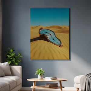May include: A canvas print depicting a surrealist image of a melting clock in a desert landscape. The clock has a light blue face with black numerals and hands, and a gold-colored frame. The desert has golden sand dunes under a clear blue sky.