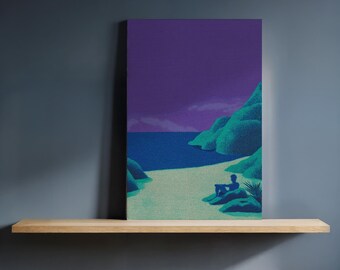 May include: A canvas print depicting a serene beach scene. The artwork features a person sitting on the shore, with turquoise water, green hills, and a purple sky. The print is displayed on a wooden shelf against a dark blue wall.