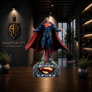 May include: A Superman figurine featuring the character in a blue suit with a red cape and yellow emblem, standing on a rocky base with a glowing yellow Superman logo. The figure is displayed in a dark room with the text QUANTUM STL 3D DESIGN STUDIO.