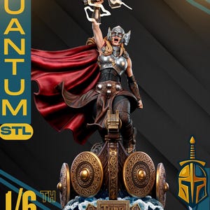 May include: A detailed statue of Thor, the Mighty, holding a hammer aloft. The figure is clad in armor and a red cape, standing on a base with shields and the text "Thor". The image includes the text "Quantum STL" and "1/6 Scale".
