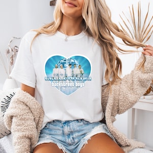May include: White t-shirt featuring a heart-shaped graphic with the text "Into the Millennium Backstreet Boys." The graphic includes a photo of the band members in white outfits against a blue background.