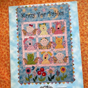 May include: A rustic wooden sign with the text "Welcome to our home" in white lettering. The sign features a distressed finish and a simple, inviting design, perfect for a front porch or entryway.