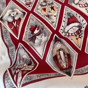 May include: A fabric featuring a red and white diamond-patterned print with various holiday illustrations. The design includes snowmen, mittens, angels, and ornaments within each diamond shape, accented by small stars and decorative borders.