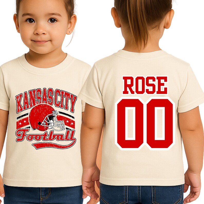 A young girl wearing a white t-shirt with a graphic design and the name "ROSE" printed on the back.