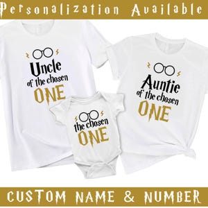 May include: White t-shirts and a onesie with black text and gold accents. The shirts read "Uncle of the chosen ONE" and "Auntie of the chosen ONE". The onesie says "the chosen ONE". Text at the top says "Personalization Available".