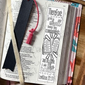 May include: A black bookmark with a pink tassel and a white paper bookmark featuring the black ink text Therefore you shall keep my commandments, and do them. I am the LORD. Leviticus 22:31, alongside an illustration of two stone tablets.