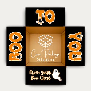 May include: An open cardboard box with black panels featuring orange text that spells "BOO" and "TO YOU". The box interior has a white box logo and the words "Care Package Studio". The bottom panel reads "From your Boo Crew" with a ghost illustration.