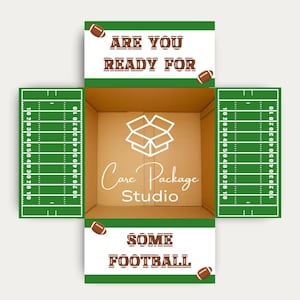 May include: A cardboard shipping box with open flaps featuring a green football field design on the side flaps and white panels with brown text reading ARE YOU READY FOR SOME FOOTBALL and brown football graphics. The center features a white logo.