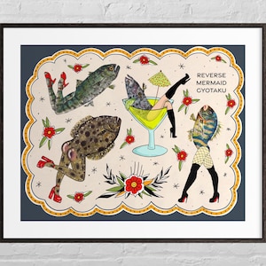 May include: A framed art print featuring a whimsical illustration of fish with human legs and high heels. The artwork includes a cocktail glass, floral accents, and the text "REVERSE MERMAID GYOTAKU". The color palette includes green, red, and tan.