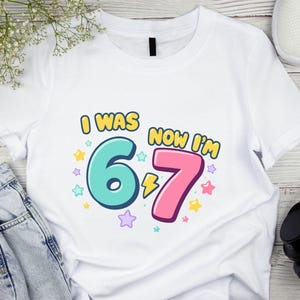 Funny 7th Birthday Digital Download, I Was 6 Now I’m 7 Kids Png File, Birthday Girl File, Gift For Alpha Kids, Gift Fou You Png
Six Seven 67 PNG SVG Cut File, Funny Viral Meme 67 Svg for Cricut Silhouette, Gen Alpha Trendy Printable Png for Shirts Mugs Crafts
Six Seven SVG PNG 6 7 Meme Funny Hands Viral Internet Humor 67 Trend Digital Download