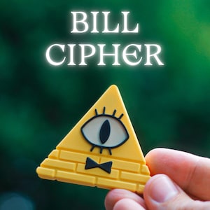 May include: Yellow triangle-shaped pin featuring the character Bill Cipher from the animated series. The pin has a brick pattern, an eye, and a black bow tie. The text "BILL CIPHER" is above the pin.