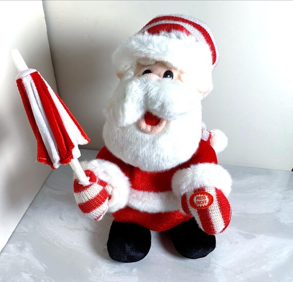 T.L. Toys Singing Plush Stuffed Santa Umbrella, 