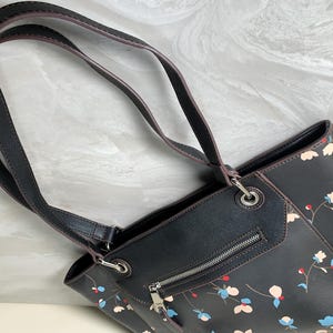 chaps small black tote travel bag Dura-Tech Padded Chap center back pocket has a bottom zipper (to convert pocket into a sleeve to slide over rolling luggage handles) Leather Chaps with Adjustable Lace