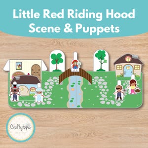 Op de afbeelding: Een Little Red Riding Hood scène en poppenset. De scène toont een brug, rivier, huizen en bomen. De poppen zijn onder andere Roodkapje, de wolf en andere personages. De tekst "Little Red Riding Hood Scene & Puppets" staat bovenaan.