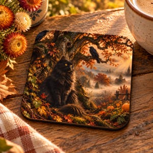 May include: A square coaster featuring a detailed illustration of a fluffy black cat sitting at the base of a tree in an autumn forest. A black crow is perched on a branch above, with orange pumpkins, golden foliage, and a misty landscape visible.