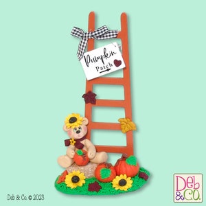 Paulie&#39;s Pumpkin Patch -Handmade Polymer Clay Collectible Bear with Wooden Ladder Figurine for Fall Decor