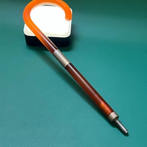 Red bakelite umbrella handle.