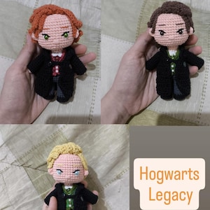 May include: Crocheted dolls of characters from Hogwarts Legacy. Each doll has a unique hairstyle and outfit, including a black coat and a green and white shirt. The dolls are held in hands, with the text "Hogwarts Legacy" in the bottom right corner.