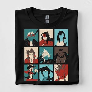 May include: Black t-shirt featuring a grid of nine character portraits in a minimalist style. Each portrait is a different character with distinct features, rendered in a palette of red, blue, and beige. The shirt is made of a soft material.