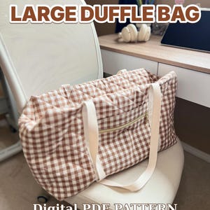 May include: A large duffle bag featuring a brown and white gingham quilted pattern with white fabric straps and a gold-toned zip on the front pocket. The text LARGE DUFFLE BAG, Digital PDF PATTERN, Video TUTORIAL, US Letter + A4 is visible.