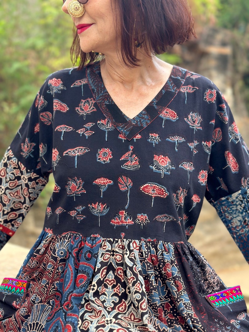 A wearable art dress of hand dyed cottons. An Individual design, highlighted with colorful Indian hand embroidery decorating the pockets image 10