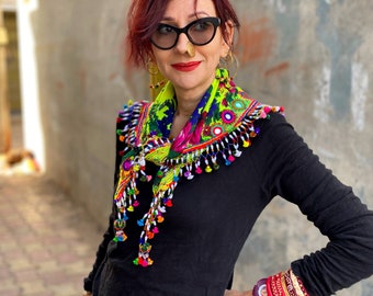 Colorful scarf with a fringe of tassels and beadwork.