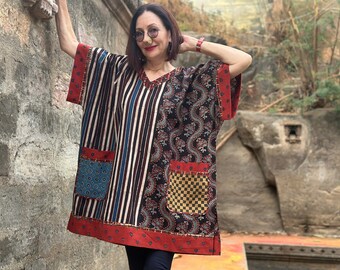 Cotton kaftan tunic with an asymmetrical design. It has a V neckline and pockets. Loose fitting style with a wide sleeve!