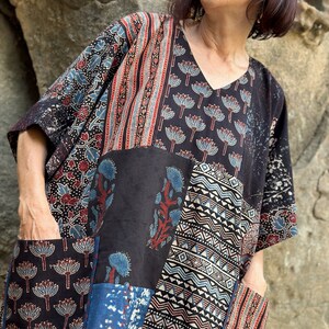 Cotton kaftan tunic with an asymmetrical patch design of Ajrakh. It has a V neckline and pockets. Loose fitting style with a wide sleeve image 9