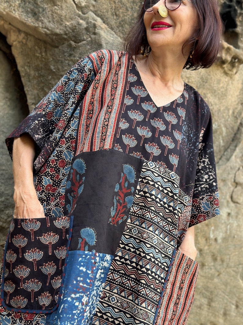 Cotton kaftan tunic with an asymmetrical patch design of Ajrakh. It has a V neckline and pockets. Loose fitting style with a wide sleeve image 9