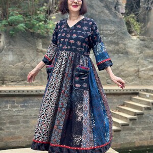 A wearable art dress of hand dyed cottons. An Individual design, highlighted with colorful Indian hand embroidery decorating the pockets image 3