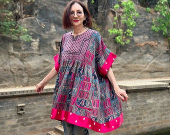 Short Kaftan features rare Indian embroidery neckline. Cotton floral printed in a colorful patchwork highlight shades in the colorful bodice