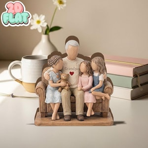 May include: A decorative figurine depicts a grandfather seated with three granddaughters on a brown sofa. The grandfather wears a shirt with "Grandpa" and a heart. The girls are in dresses and overalls, one holding a teddy bear. A mug, flowers, and books are in the background.