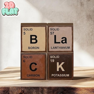 May include: Four wooden blocks with periodic table elements: Boron, Lanthanum, Carbon, and Potassium. Each block has a different color and the element's symbol, atomic number, and name. The blocks are arranged in a 2x2 grid.