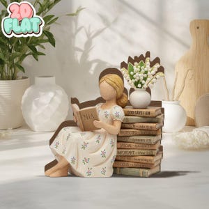 May include: A figurine of a woman reading a book with the name "MIA" on the cover. She is seated next to a stack of books with religious quotes and a small vase of flowers. The figurine is wearing a floral dress.