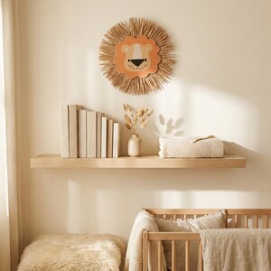 Natural safari nursery wall decor featuring handmade lion and tiger designs with wooden faces and textured fiber details, perfect for boho baby room, neutral nursery styling, and kids room wall art