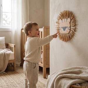 Natural safari nursery wall decor featuring handmade lion and tiger designs with wooden faces and textured fiber details, perfect for boho baby room, neutral nursery styling, and kids room wall art