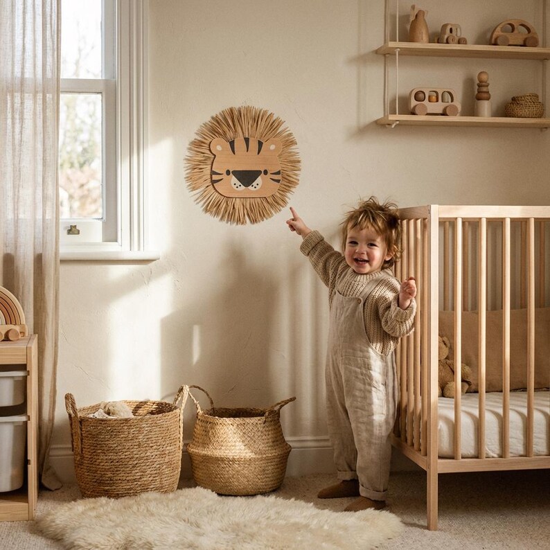 Natural safari nursery wall decor featuring handmade lion and tiger designs with wooden faces and textured fiber details, perfect for boho baby room, neutral nursery styling, and kids room wall art