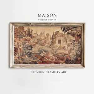 Op de afbeelding: Een ingelijste vintage print met een landschap met bomen, gebouwen en een rivier in bruin-, beige- en groentinten. De lijst is lichtbruin. De tekst "MAISON VINTAGE PRINTS" en "PREMIUM FRAME TV ART" zijn zichtbaar.