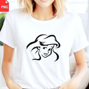 May include: White t-shirt featuring a black line drawing of a cartoon character's face. The character has long flowing hair and a smiling expression. The shirt is made of a soft material and has short sleeves.