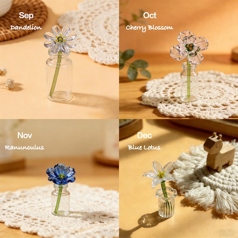 May include: Four small glass vases each hold a different flower: a dandelion, cherry blossom, ranunculus, and blue lotus. Each flower is labeled with its name and the month it represents. The vases sit on decorative doilies.